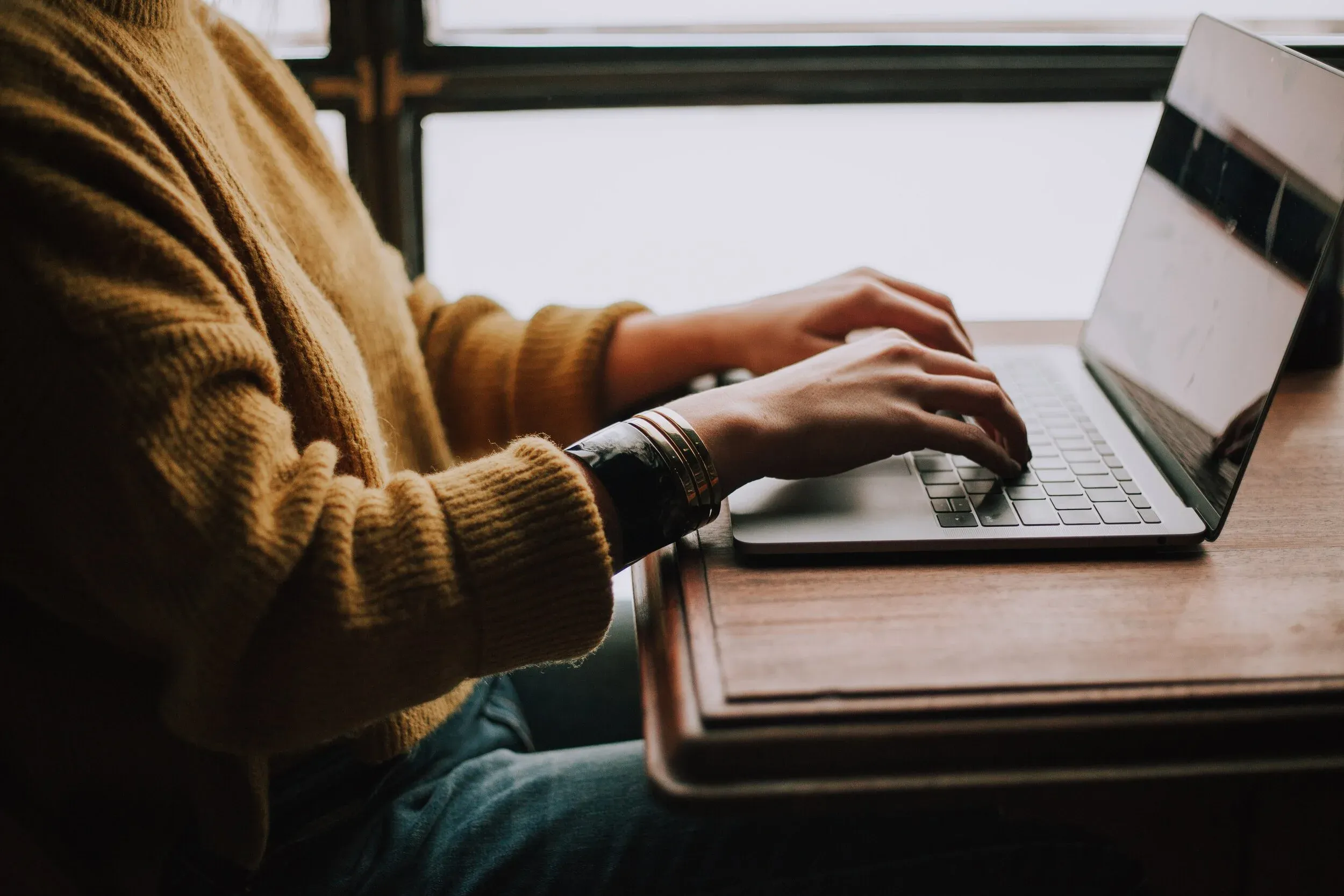 A researcher working on a laptop.